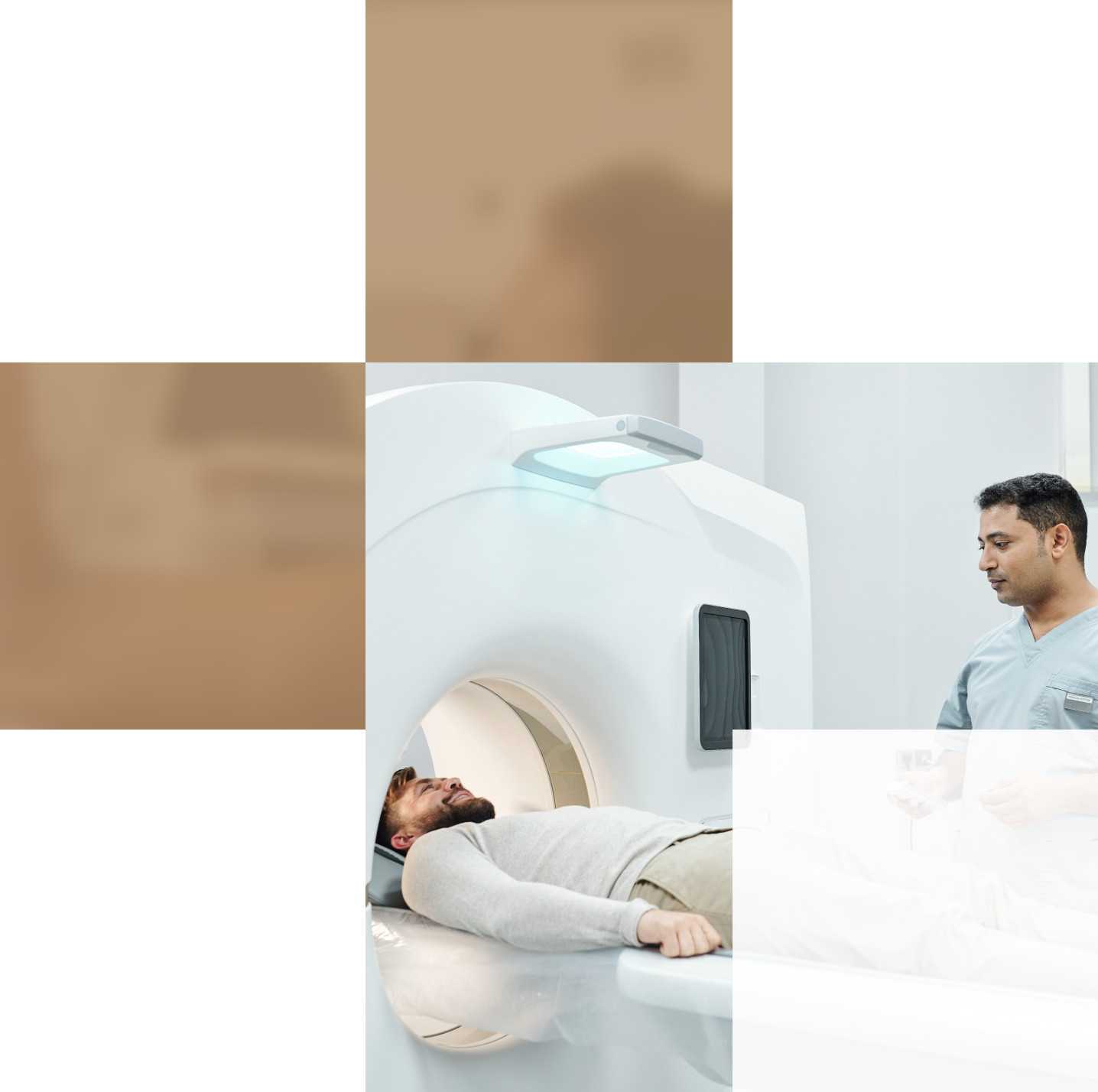 A patient lies on a table inside a medical imaging machine while a healthcare professional, wearing scrubs, attentively looks at him.