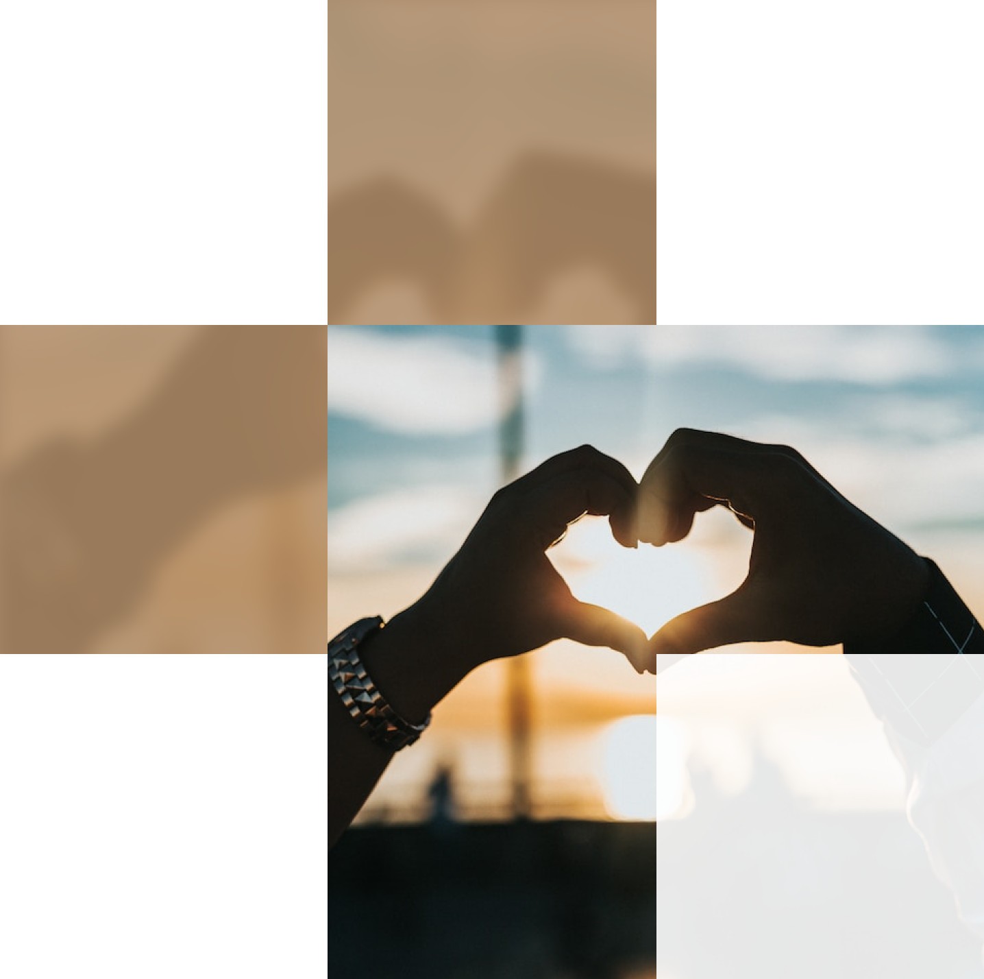 Silhouetted hands forming a heart shape against a sunset background.