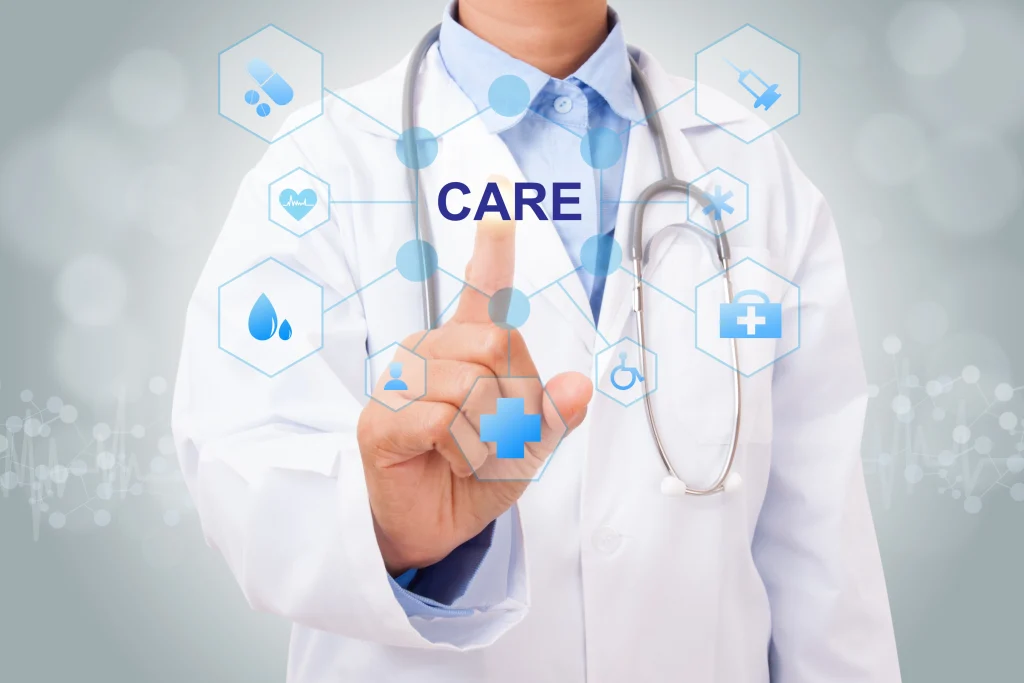 A person in a white lab coat with a stethoscope is interacting with digital health icons, pointing at the word "CARE" amidst symbols representing medical concepts.