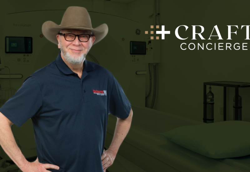 Jim "Hoot Owl" Jefferies stands in front of a CT scanner at Craft Concierge in Tulsa, Oklahoma.